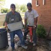 Jeff Lewis and Julio Robles display the time capsule plaque.